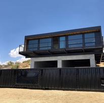https://www.livinginacontainer.com/wp-content/uploads/2020/05/The-Black-Box-Home-from-Yucca-Valley-4.jpg?ezimgfmt=rs:206x205/rscb9/ngcb9/notWebP